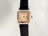 a watch that is sitting on top of a black strap