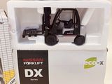 a toy forklift truck that is sitting on top of a box