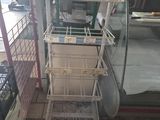 a lot of cages that are sitting on the floor