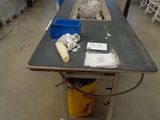 a long table with a bunch of items on it