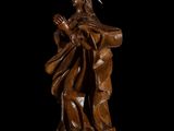 a wooden statue of jesus with a crown on his head