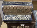 three accordions sitting on top of each other on a table