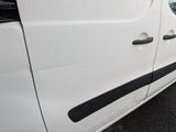 a white van parked on the side of the road
