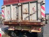 a dump truck that is parked on the side of the road