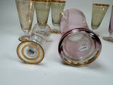 a lot of glass items that are sitting on a table