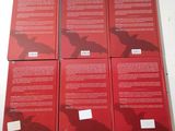 four red books are stacked on top of each other on a table