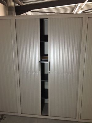 an image of a closet with a sliding door in a garage