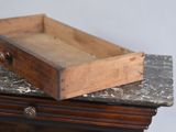 a wooden box sitting on top of a marble counter
