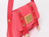 a small pink purse with a gold buckle on it