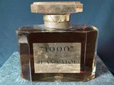 an image of a bottle of perfume on a table