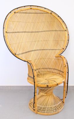 an image of a wicker chair in a room with a white wall