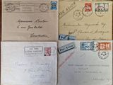 several old envelopes are sitting on top of a wooden table