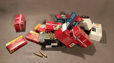 a pile of cigarettes and cigarettes on a table