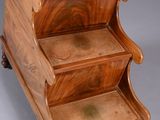 an old wooden step stool with three steps on each side