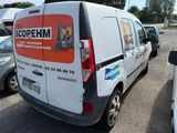 a white van that is parked in a parking lot