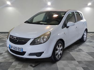 a picture of a white opel parked in a garage