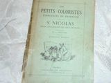 an old book on a table with a white table cloth