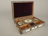 a silver and white box with a mirror inside