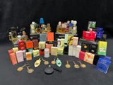 many different types of perfumes and keychains on the table