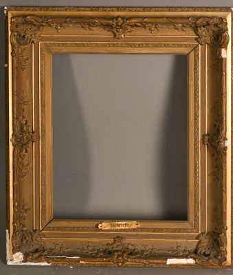 Petit cadre en bois et stuc doré à décor de fleurettes Chass…