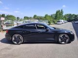 a picture of a black sports car parked in a parking lot