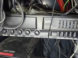 a rack with a bunch of electronics and wires on it