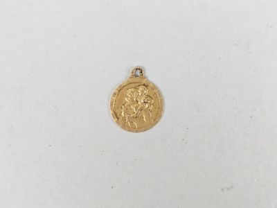 a close up of a gold coin on a white surface