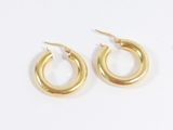 a pair of gold hoop earrings on a white background