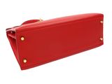 the red leather purse is open and ready to be used