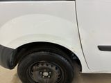 a white van that has a flat tire on the side of it