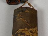 a small case with a picture of a man and a dog on it