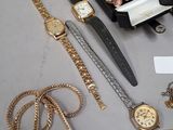 a lot of gold and silver jewelry on a table