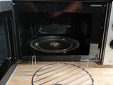 a microwave that is sitting on a counter with a rack