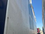 a truck that is parked in front of a building