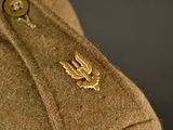 a close up of a military uniform with a badge on it
