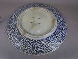 a blue and white plate with a blue design on it