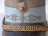a close up of a hat with a chain around it