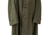 une photo d'un manteau vert sur un mannequin