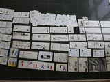 several pieces of paper are arranged on a black surface in a room