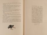 an open book with a picture of a bird on it