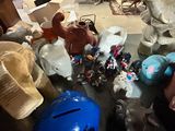 a lot of stuffed animals that are sitting on the floor