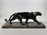 statue of a black panther on a marble base on a white background