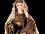 an image of a doll of a woman dressed in a medieval costume