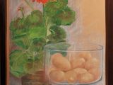 framed oil painting of a glass bowl of fruit and a gerania plant