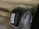 two tires sitting next to each other in a garage