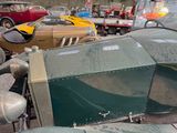 many old cars that are parked in a parking lot