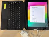 two laptops and a tablet on a table