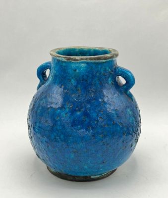 a blue vase with handles on a white background