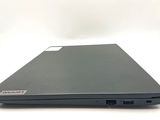 the back view of a laptop with a black cover on a white surface