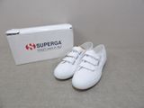 white superga sneakers with a box on the floor